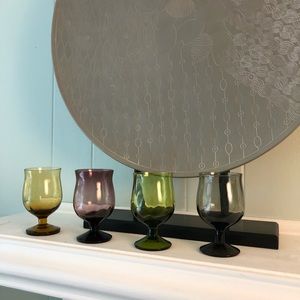 Set of four multi colored cordial glasses.
